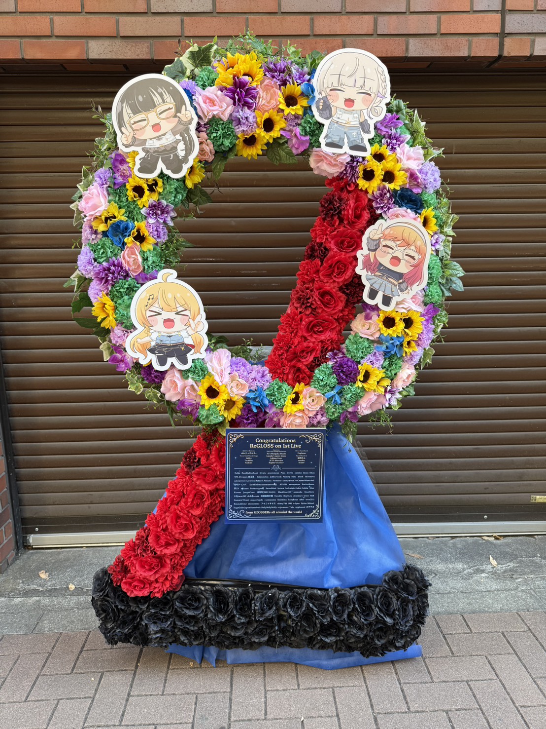 ReGLOSS 1st Live “Flashpoint” フラワースタンド 受付 宛 様 フラスタ - 赤、黄、紫を基調とした生花、パネルスタイルのフラワースタンド。価格帯：10万円~